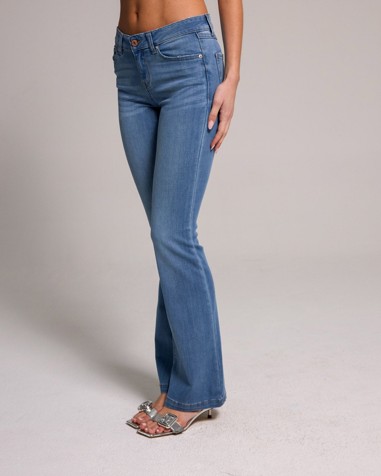 Stylish Low Rise Bootcut Jeans - Medium Blue Black, crafted from soft cotton blend for comfort and versatility.